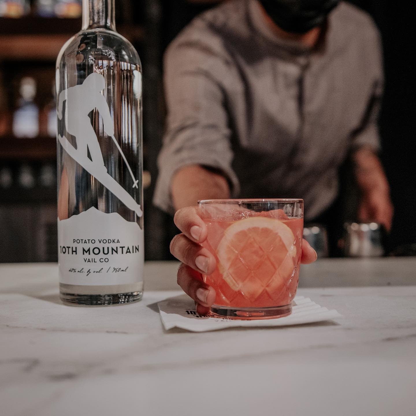 Vodka cocktail served by bartender